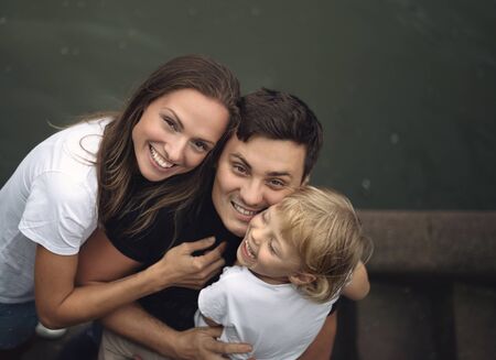 Happy family, little girl and her parents.の写真素材