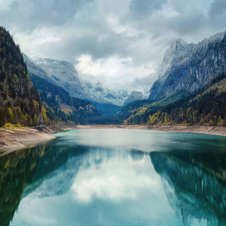 Alpine lake with dramatic sky and mountains. heritage site. Gosausee, Tirol, Austriaの写真素材