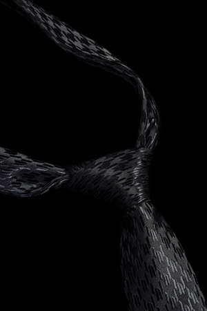 Classic black tie isolated on black backgroundの写真素材