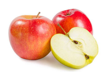 Two red apple with one cutted on half isolated on white backgroundの写真素材