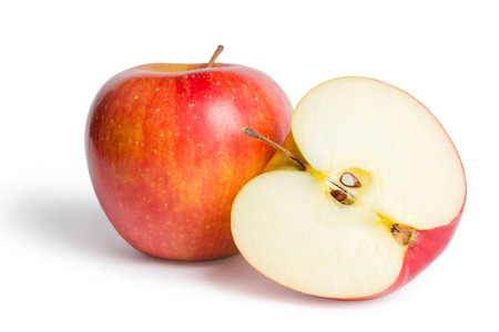 Red apple with one cutted on half isolated on white backgroundの写真素材