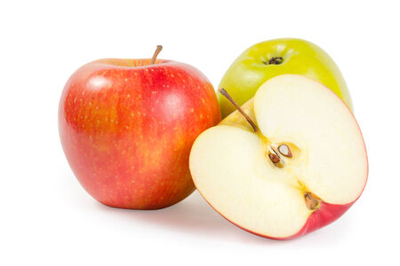 Two apples and one cutted on half isolated on white backgroundの写真素材