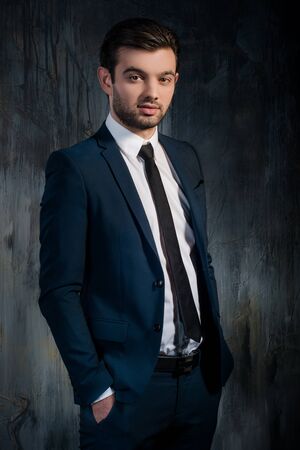 Portrait of successful businessman in blue suitの写真素材