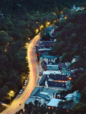 Light trails on the mountain road through forest at night. Lower Austriaの写真素材