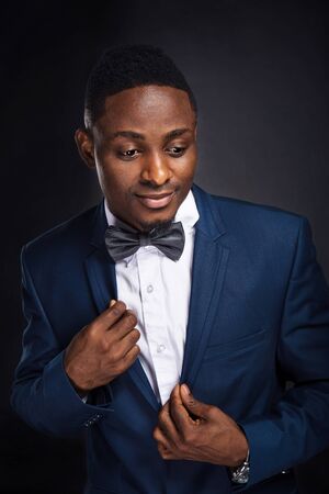 African american successful businessman on black backgroundの写真素材