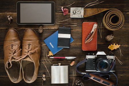 Top view of modern collection for travel on wooden background. Autumn mood conceptの写真素材