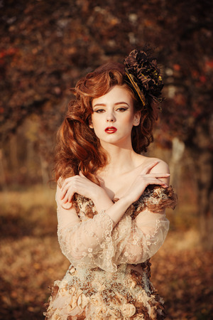 Portrait of beautiful sensual woman in autumn seasonの写真素材