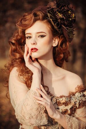 Portrait of beautiful sensual woman in autumn season. Soft sunny colorsの写真素材