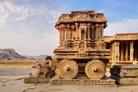 Stone chariot in courtyard of Vittala Temple at sunset in Hampi, Karnataka, Indiaの写真素材
