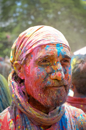 Kuala Lumpur, Malaysia - March 26, 2016: Man portrait during Holi Festival of Colors. Indian people celebrate holi in other country in Shree Lakshmi Narayan temple in Kuala Lumpur. Holi is a spring festival celebrated as a festival of colours.のeditorial素材