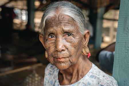 Kyee Chaung, Myanmar - May 30, 2016: Portrait of old woman with facial tattoos in Chin villages, Mrauk U regionのeditorial素材