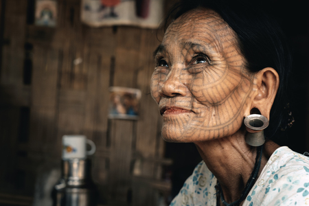 Kyee Chaung, Myanmar - May 30, 2016: Portrait of old woman with facial tattoos in Chin villages, Mrauk U regionのeditorial素材