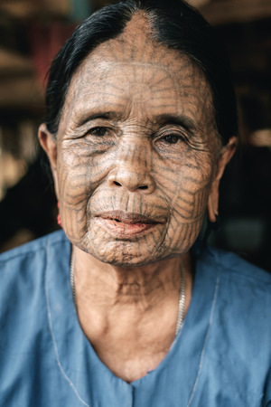 Kyee Chaung, Myanmar - May 30, 2016: Portrait of old tattooed woman in Chin villages, Mrauk U regionのeditorial素材
