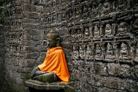 Ancient Buddha statue in Kothaung Paya temple in Mrauk-U city, Rakhine state, Myanmarの写真素材