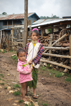 Pan Pet, Myanmar - May 25, 2016: Children from Padaung (Karen) hill tribe walking in the Pan Pet village, Myanmarのeditorial素材