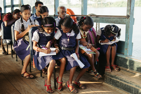 Alleppey, India - January, 28, 2016: Indian children get to school by boat in Kerala backwatersのeditorial素材