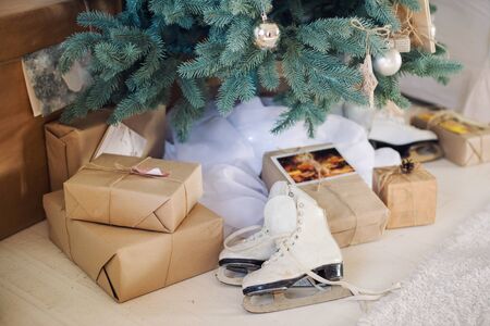 Christmas tree decorated with balls on branches and giftsの写真素材