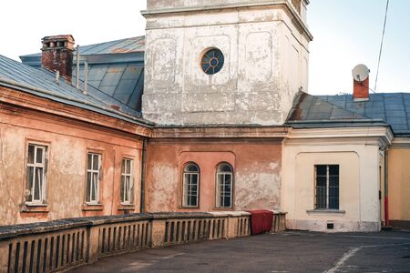 Beautiful ancient architecture in old Lvov Ukrainian city. Empty cozy yard in the morning.の写真素材