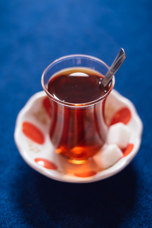 Turkish drink of tea on blue table background in traditional tearoom の写真素材