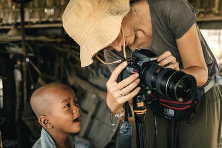Pan Paung, Myanmar - May 30, 2016: Children from Chin state village meet tourist woman and and looking curiously picture from cameraのeditorial素材