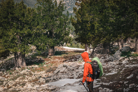 Female backpacker looking at evergreen landscape of Tahtali mountainの写真素材