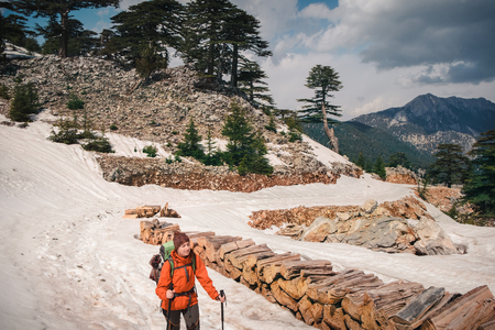 Hiker conquering the snowy part of Lycian way on a mountainの写真素材