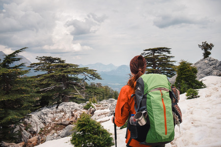 Traveler shot from back standing on the mountain side looking ahead.Turkeyの写真素材