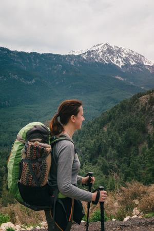 Backpacker on her way to Tahtali on its backgroundの写真素材