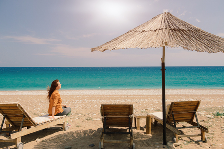 Traveler sitting on the chaise-lounge  having a sunbath in Turkey on a sunny day in Turkeyの写真素材