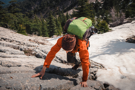 Female traveler climbing up Tahtali mountain. Shot from above.の写真素材