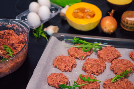 Healthy and vegetarian food. Vegetable cutlets from pumpkin, egg, carrot, millet and beetrootの写真素材