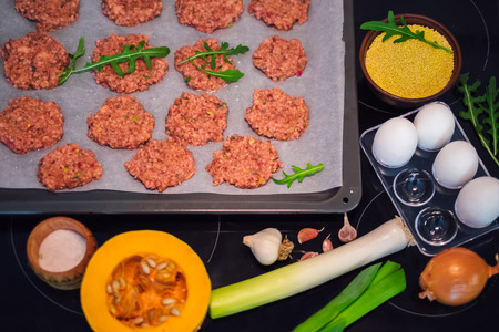 Healthy and vegetarian food. Vegetable cutlets from pumpkin, egg, carrot, millet and beetrootの写真素材
