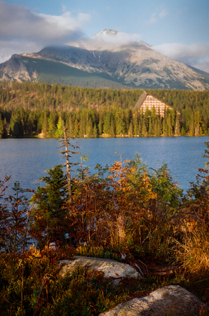 Strbske Pleso on a sunny day, shot from other bank of the lake. Spring. Shot with film camera with grain.の写真素材