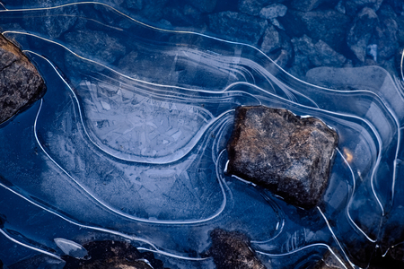 Close-up blue ice texture of frozen lakeの写真素材