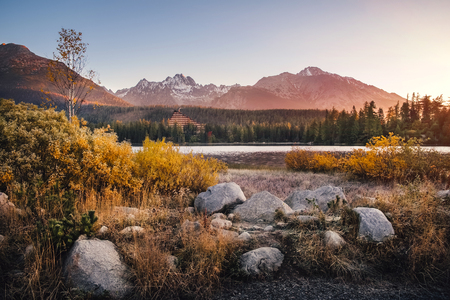 Breathtaking Strbske mountain lake with its reflections on sunrise in Autumn, High Tatras in the backgroundの写真素材
