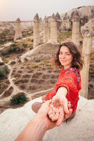 Beautiful woman enjoying amazing view of love valley canyon in Cappadocia landscape. Travel in Turkeyの写真素材