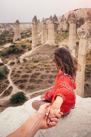 Beautiful woman enjoying amazing view of love valley canyon in Cappadocia landscape. Travel in Turkeyの写真素材
