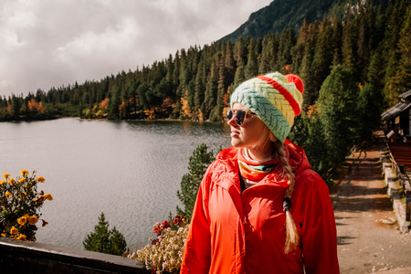 Traveler woman enjoying beautiful mountain lakeの写真素材