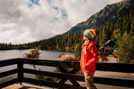 Traveler woman enjoying beautiful mountain lake