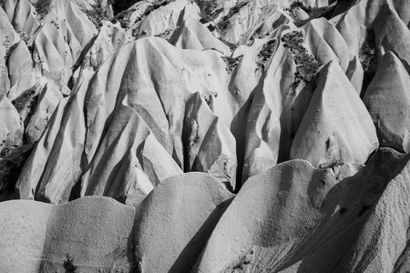 Beautiful black and white mountain landscape in Cappadocia Rose valley with big limestone hills, Turkey, Goremeの写真素材