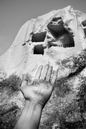 Beautiful black and white mountain landscape in Cappadocia Rose valley with cave house and ancient church ruins, Turkey, Goremeの写真素材