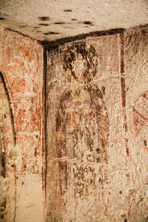 Christian fresco in ancient cave church of Rose Valley in Cappadocia mountain landscape. Travel in Turkeyの写真素材