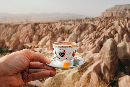 Traditional Turkish drink on rose valley landscape background in Cappadocia, Goremeの写真素材