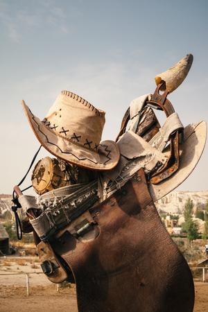 Close up cowboy element hat, saddle, on the farmの写真素材