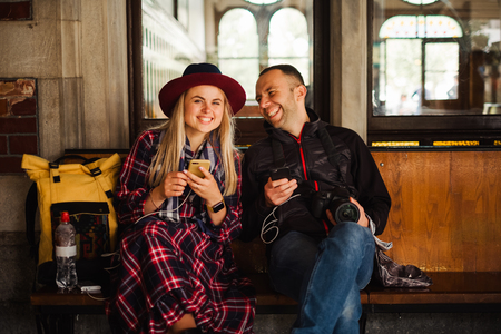 Happy beautiful tourist couple waiting train on Orient Express railway station in Istanbul Travel to turkeyの写真素材