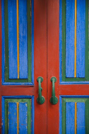 Old colorful blue and red closed doorの写真素材