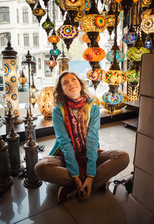 Traveler woman enjoying traditional turkey light lamp decoration design. Travel to Turkeyの写真素材