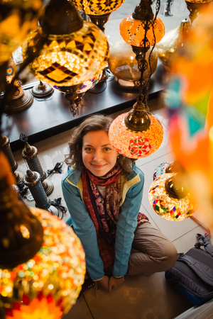 Traveler woman enjoying traditional turkey light lamp decoration design. Travel to Turkeyの写真素材