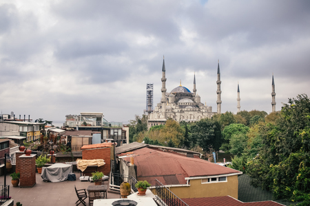 Sultanahmet blue mosque and roof of old house on Istanbul streetの写真素材
