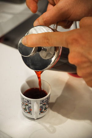 Drink cup of turkish aromatic red flower herbal tea on Grand Bazaar marketの写真素材